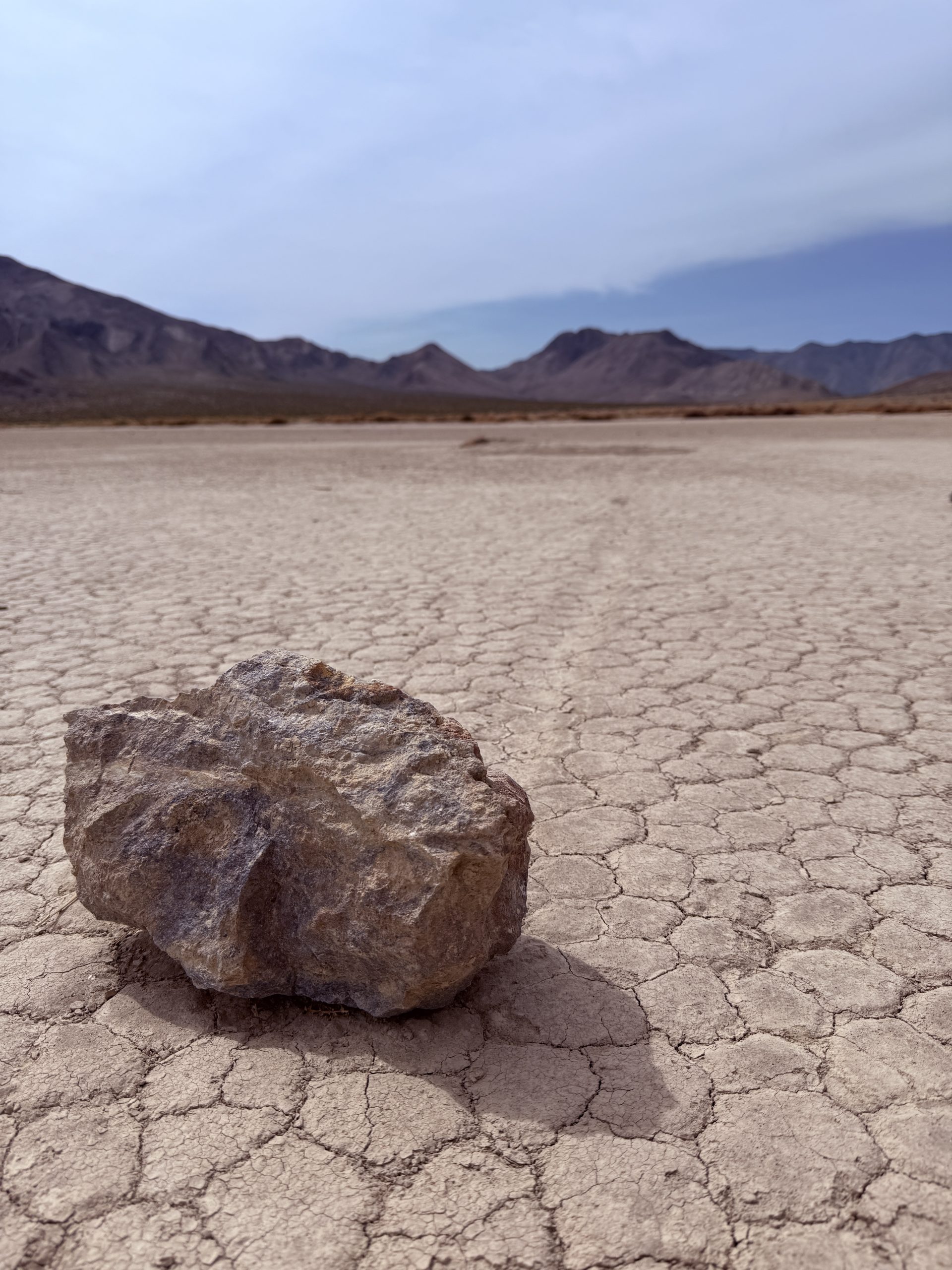"Sailing stone" with visible trail in Racetrack Playa in Death Valley