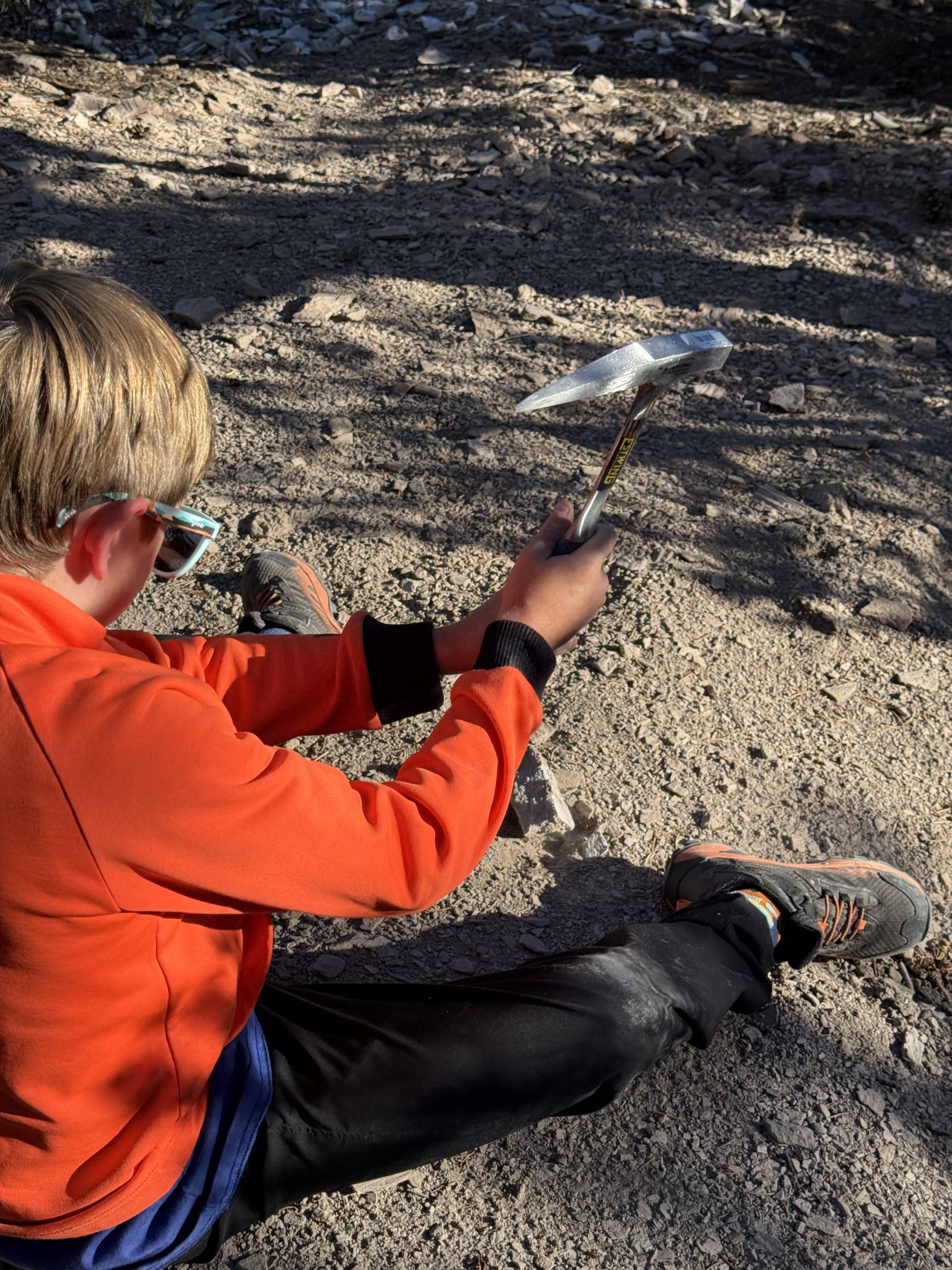 Boy breaking rocks at Garnet Hill