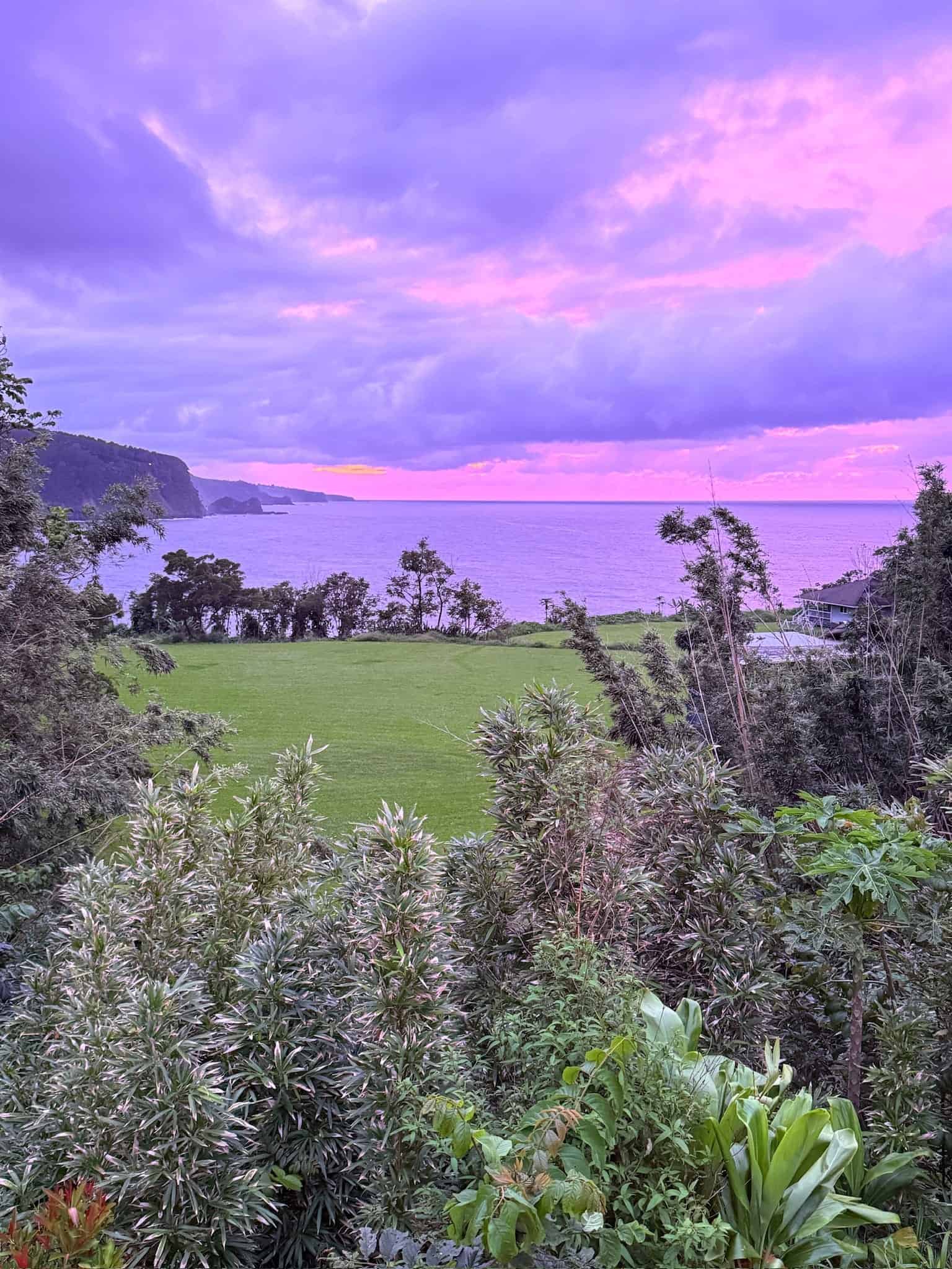 Purple and pink sunset sky over the ocean viewed from Ke'anae Uka campground on the Road to Hāna